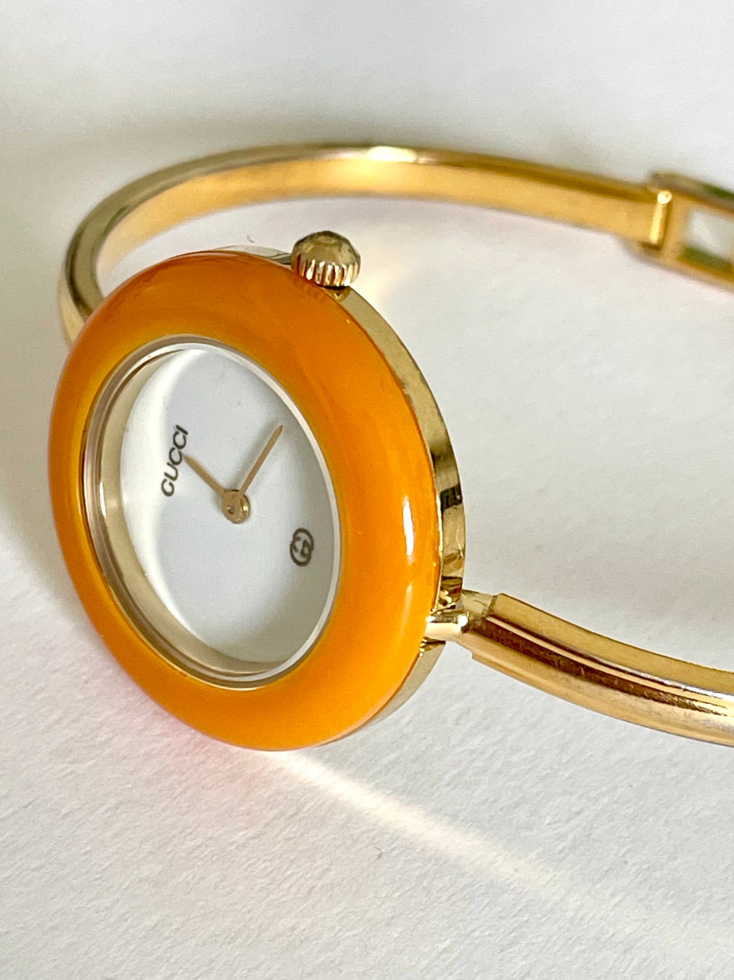 Vintage Gucci Women’s Watch – Gold Bangle with Interchangeable Orange Bezel