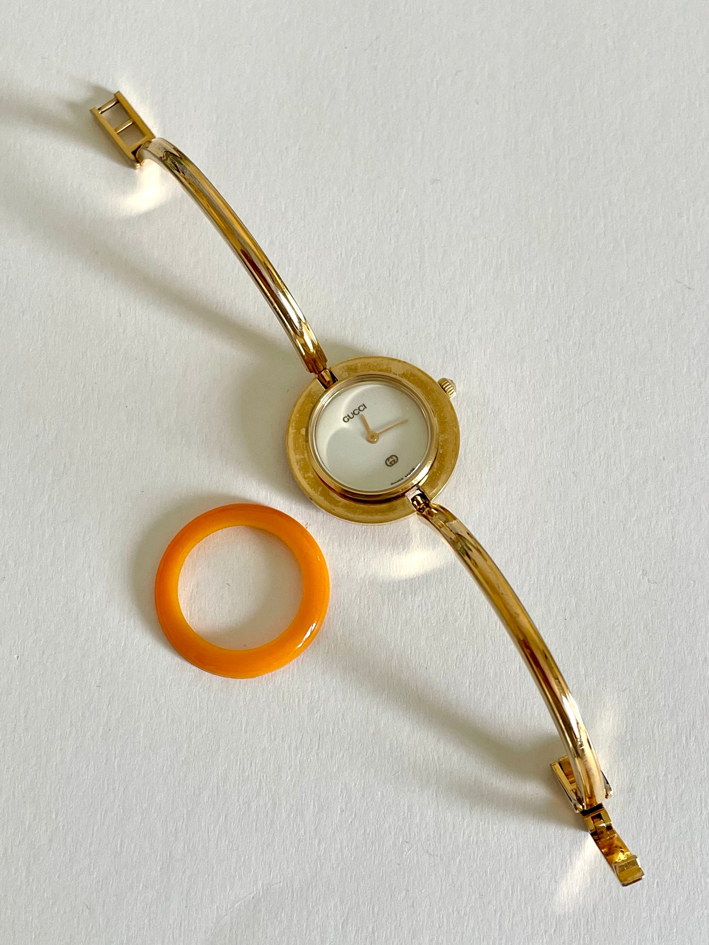 Vintage Gucci Women’s Watch – Gold Bangle with Interchangeable Orange Bezel