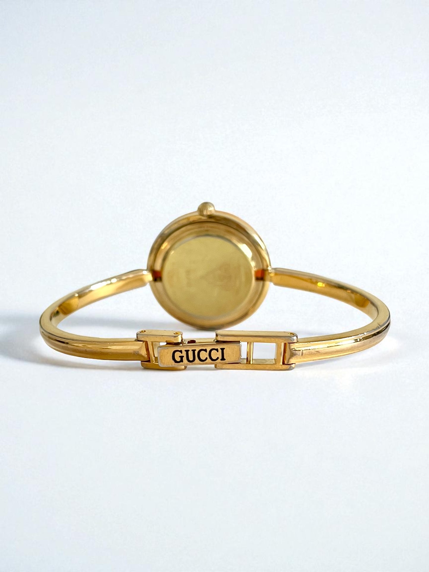 Vintage Gucci Women’s Watch – Gold Bangle with Interchangeable Orange Bezel