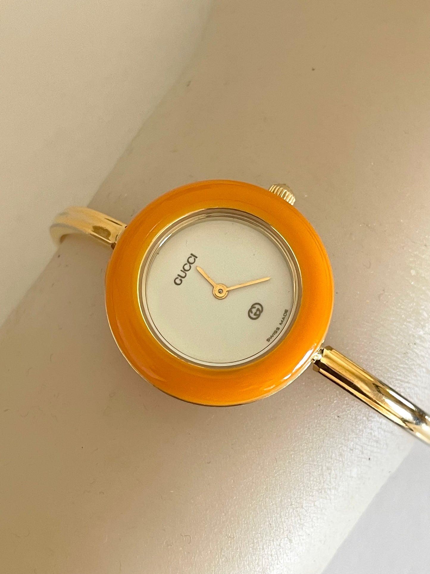 Vintage Gucci Women’s Watch – Gold Bangle with Interchangeable Orange Bezel