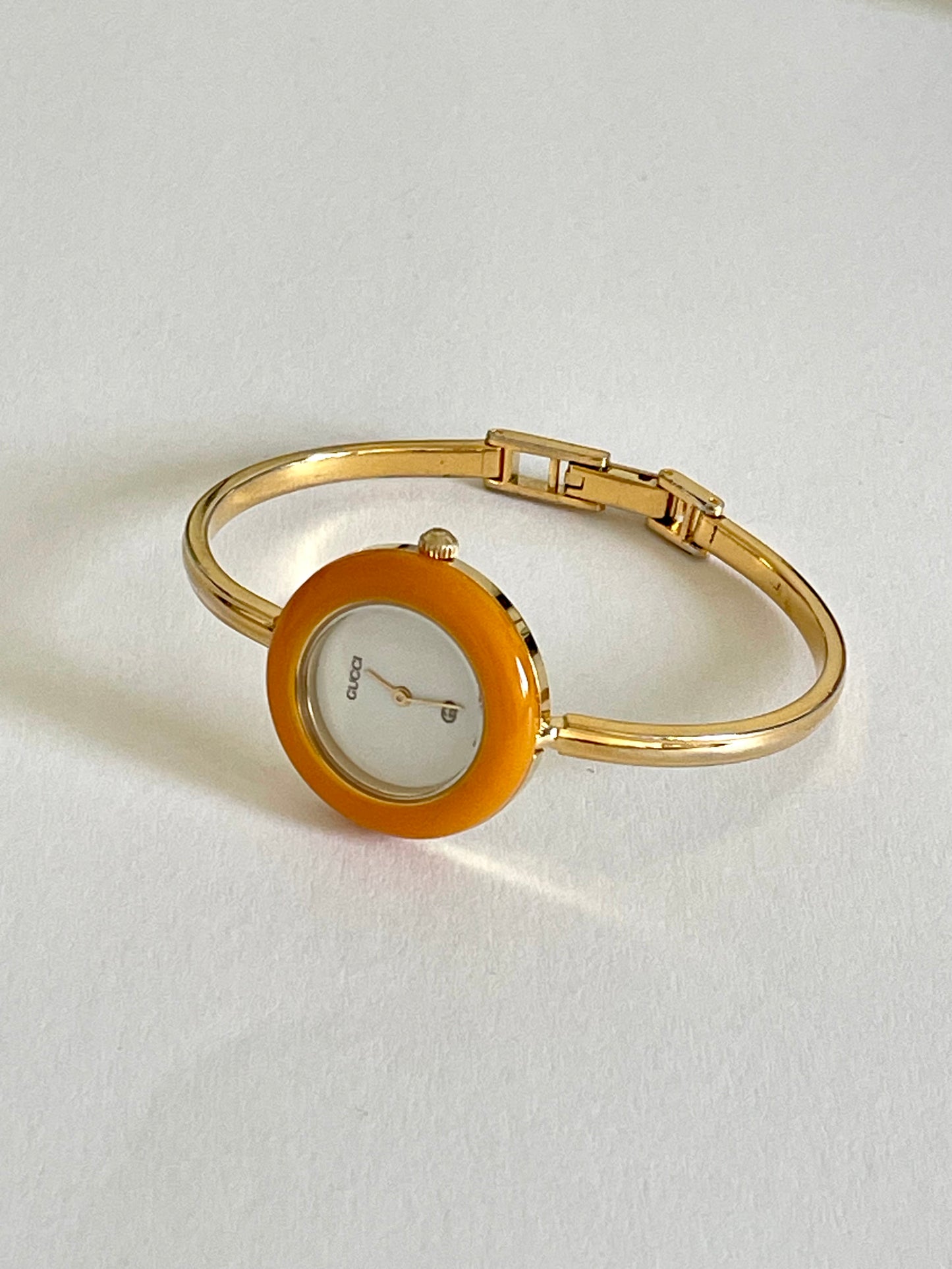 Vintage Gucci Women’s Watch – Gold Bangle with Interchangeable Orange Bezel