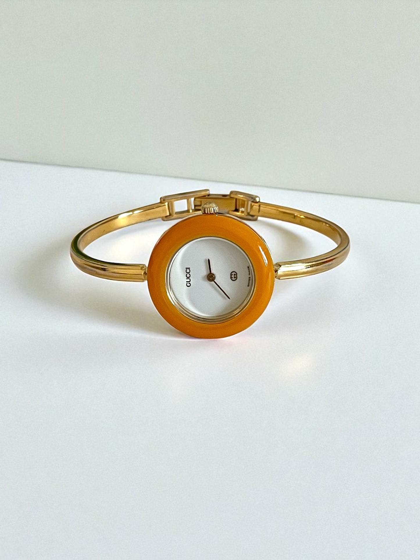 Vintage Gucci Women’s Watch – Gold Bangle with Interchangeable Orange Bezel
