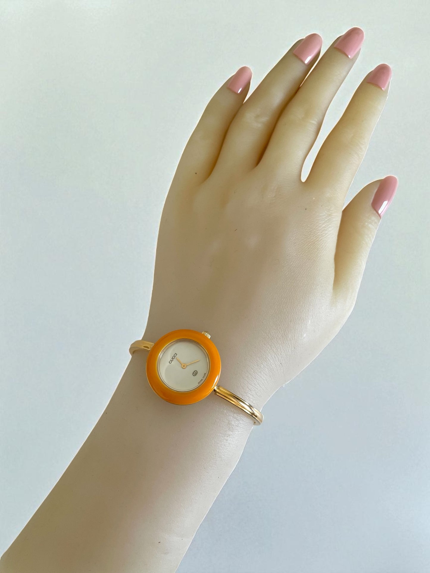 Vintage Gucci Women’s Watch – Gold Bangle with Interchangeable Orange Bezel